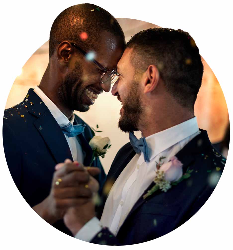 Closeup of two people dancing at a wedding.